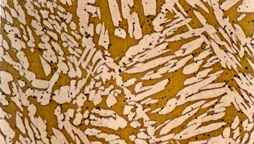 Microscopic structure of brass alloy showing copper and zinc phases